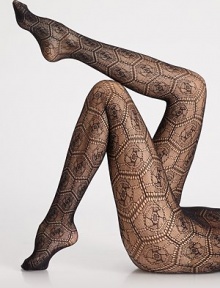 A rich geometric pattern of circles and diamonds adorns the leg, with a hint of shimmer throughout for a touch of whimsical sophistication. Soft, smooth waistbandFlat toe seam80% polyamide/20% elastaneHand washMade in Austria