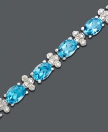 Caribbean cool color to brighten any day or night. Oval-cut blue topaz (14-1/2 ct. t.w.) and diamond accents sparkle like the ocean in this bracelet crafted in sterling silver. Approximate length: 7 inches.