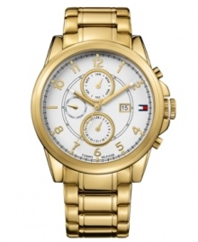 Handsome timepiece in an always-classic design from Tommy Hilfiger. Crafted of gold tone stainless steel bracelet and round case. White chronograph dial features three subdials, gold tone three hands, applied numerals, minute track, iconic flag logo and date window at three o'clock. Quartz movement. Water resistant to 50 meters. Ten-year limited warranty. Handsome timepiece in an always-classic design from Tommy Hilfiger. Crafted of gold tone stainless steel bracelet and round case. White chronograph dial features three subdials, gold tone three hands, applied numerals, minute track, iconic flag logo and date window at three o'clock. Quartz movement. Water resistant to 50 meters. Ten-year limited warranty.