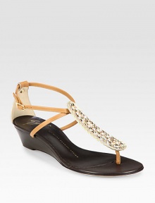 Leather wedge with a glimmering, rhinestone-coated t-strap and an adjustable ankle strap. Self-covered wedge, 1 (25mm)Leather upperLeather liningBuffed leather solePadded insoleMade in ItalyOUR FIT MODEL RECOMMENDS ordering true size. Leather wedge with a glimmering, rhinestone-coated t-strap and an adjustable ankle strap. Self-covered wedge, 1 (25mm)Leather upperLeather liningBuffed leather solePadded insoleMade in ItalyOUR FIT MODEL RECOMMENDS ordering true size.