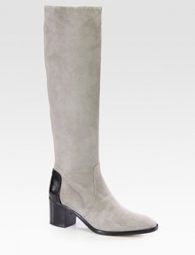 Exude casual elegance with this buttery suede silhouette, backed by a contrasting pebbled leather detail. Stacked heel, 2½ (65mm)Shaft, 16Leg circumference, 14Suede and leather upperPull-on styleLeather lining and solePadded insoleMade in Italy Exude casual elegance with this buttery suede silhouette, backed by a contrasting pebbled leather detail. Stacked heel, 2½ (65mm)Shaft, 16Leg circumference, 14Suede and leather upperPull-on styleLeather lining and solePadded insoleMade in Italy