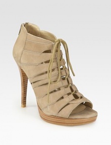 Leather cutout style with a lace-up front, peep toe and back zipper. Stacked heel, 4½ (115mm)Stacked platform, 1 (25mm)Compares to a 3½ heel (90mm)Leather upperBack zipperLeather liningBuffed leather solePadded insoleImportedOUR FIT MODEL RECOMMENDS ordering true size. 