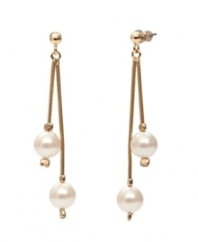 Prepare yourself for an evening of elegance. These romantic double drop earrings by Monet feature ivory-colored glass pearls set in gold tone mixed metal. Approximate drop: 2-1/4 inches. Prepare yourself for an evening of elegance. These romantic double drop earrings by Monet feature ivory-colored glass pearls set in gold tone mixed metal. Approximate drop: 2-1/4 inches.