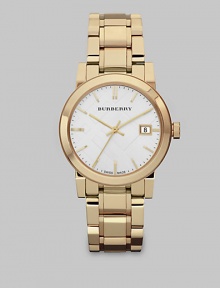 An iconic check stamped dial with a radiant goldtone stainless steel link bracelet. Swiss quartz movementWater resistant to 5 ATMRound goldtone stainless steel case, 34mm (1.3)Smooth bezelSilver check stamped dialBar hour markersDate display at 3 o'clockSecond hand Goldtone stainless steel link braceletMade in Switzerland An iconic check stamped dial with a radiant goldtone stainless steel link bracelet. Swiss quartz movementWater resistant to 5 ATMRound goldtone stainless steel case, 34mm (1.3)Smooth bezelSilver check stamped dialBar hour markersDate display at 3 o'clockSecond hand Goldtone stainless steel link braceletMade in Switzerland