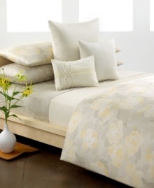 At once cheerful and calming, Calvin Klein's Poppy duvet cover set transforms your space into a beautiful oasis with watercolor florals cream and yellow on soft cotton sateen. Reverses to self; button closure.