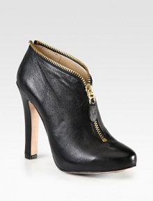 Edgy metal zip-trim adds some kick to this classic leather silhouette. Self-covered heel, 5¾ (145mm)Hidden platform, ½ (15mm)Compares to a 5¼ heel (130mm)Leather upper with zipper trimFront zipLeather liningLeather and rubber solePadded insoleImportedOUR FIT MODEL RECOMMENDS ordering one half size down as this style runs large. Edgy metal zip-trim adds some kick to this classic leather silhouette. Self-covered heel, 5¾ (145mm)Hidden platform, ½ (15mm)Compares to a 5¼ heel (130mm)Leather upper with zipper trimFront zipLeather liningLeather and rubber solePadded insoleImportedOUR FIT MODEL RECOMMENDS ordering one half size down as this style runs large.