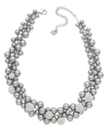 Shining in stunning silver tones, Swarovski's magnificent necklace offers a modern interpretation of a timeless classic: the pearl necklace. It features a majestic accumulation of grey crystal pearls highlighted with subtle details in sparkling clear crystal Pointiage. The rhodium-plated closure is adjustable. Crafted in mixed metal. Approximate length: 14 inches + 2-inch extender. Shining in stunning silver tones, Swarovski's magnificent necklace offers a modern interpretation of a timeless classic: the pearl necklace. It features a majestic accumulation of grey crystal pearls highlighted with subtle details in sparkling clear crystal Pointiage. The rhodium-plated closure is adjustable. Crafted in mixed metal. Approximate length: 14 inches + 2-inch extender.
