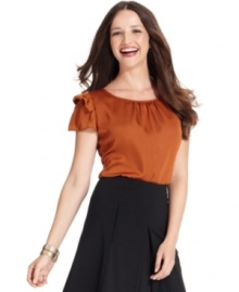 Puffed flounces at the sleeves create a feminine look on Nine West's blouse, perfect for mixing and matching with skirts, trousers and jackets for work. Puffed flounces at the sleeves create a feminine look on Nine West's blouse, perfect for mixing and matching with skirts, trousers and jackets for work.