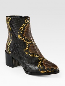 An exotic print defines this classic ankle boot crafted of textured leather with a smooth patent-covered heel. Patent leather heel, 2 (50mm)Snake-print leather upperSide zipLeather lining and solePadded insoleImported An exotic print defines this classic ankle boot crafted of textured leather with a smooth patent-covered heel. Patent leather heel, 2 (50mm)Snake-print leather upperSide zipLeather lining and solePadded insoleImported