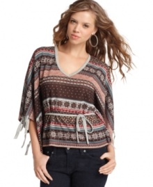 Fair Isle knit gets a modern makeover from Almost Famous! With cute fringe details and soft drape, this poncho is perfect for layering. Fair Isle knit gets a modern makeover from Almost Famous! With cute fringe details and soft drape, this poncho is perfect for layering.