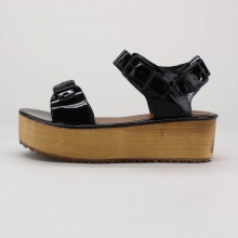 Lift your style to new heights in these women's platform sandals. Open toed and ready for action, these sandals feature a 1.5" platform and shiny patent straps. Constructed of man-made materials. Imported. Lift your style to new heights in these women's platform sandals. Open toed and ready for action, these sandals feature a 1.5" platform and shiny patent straps. Constructed of man-made materials. Imported.
