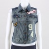 This vintage women's denim vest is the perfect layering piece. This varsity style vest features a distressed, worn-in look, front button closure and is highlight with patch details on the front. 100% Cotton. Dry clean only. Imported.