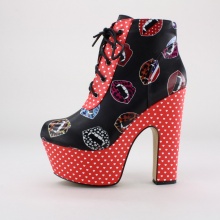 Upgrade your unique style with these one of a kind platform booties from Iron Fist. These distinctive booties feature a printed synthetic leather upper, lace-up closure, 2"  platform and 6"  heel. Imported.